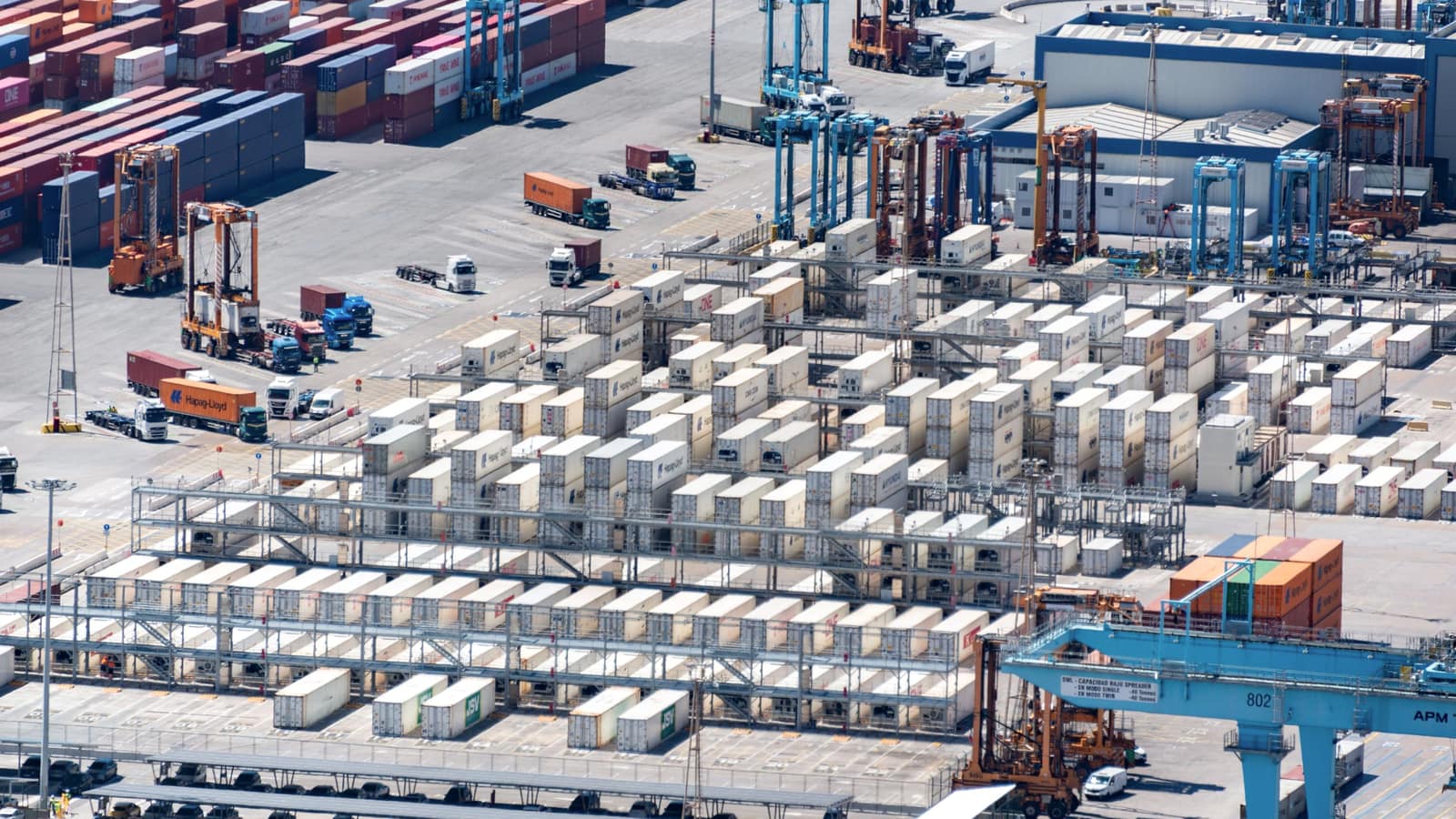 An aerial view of a container terminal, stacks and straddle carriers