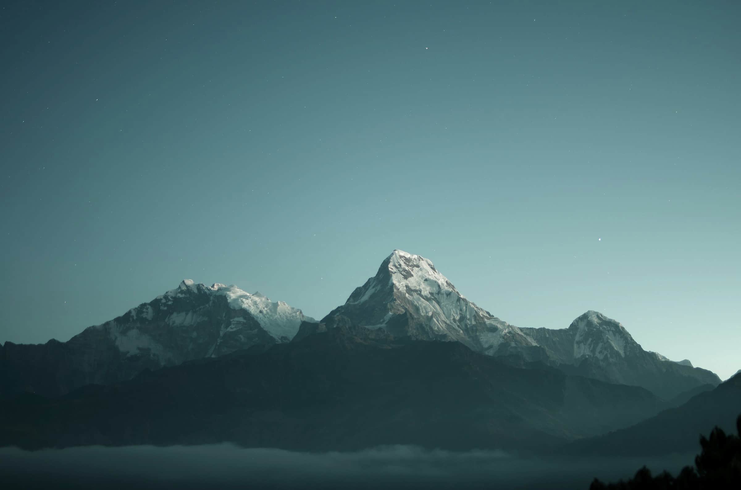 Snow peaks of the Annapurna range above a layer of cloud, Nepal