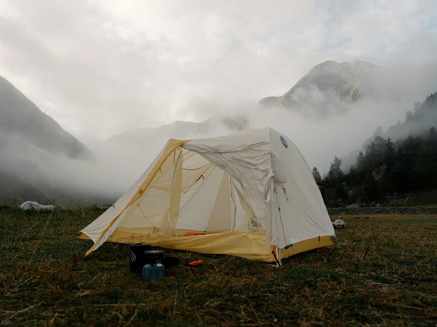 A single tent on a valley floor under low cloud, Mont Blanc massif